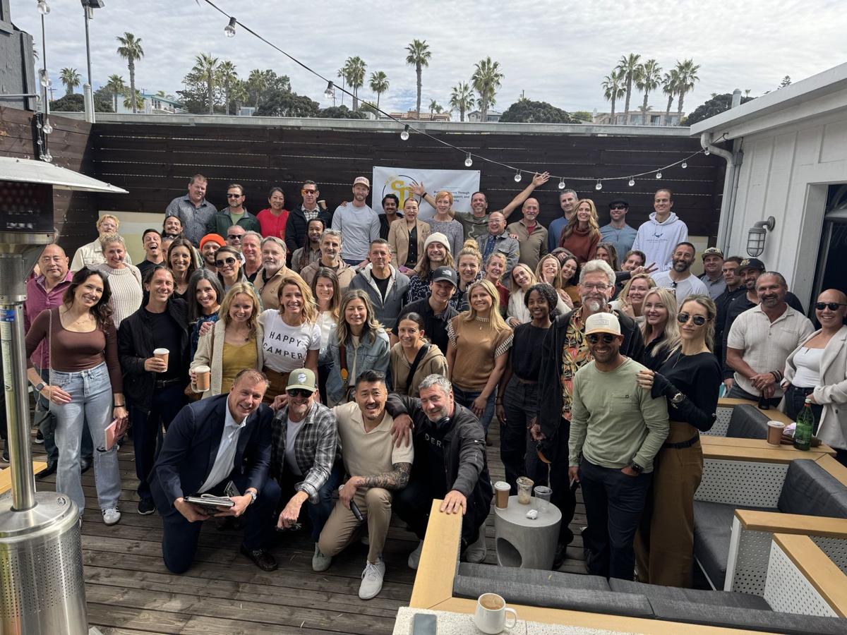 Members of The Group together on a rooftop